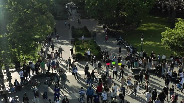 people protesting the brutal killing by - demonstrators with signs in Washington Square Park in New York City NYC
