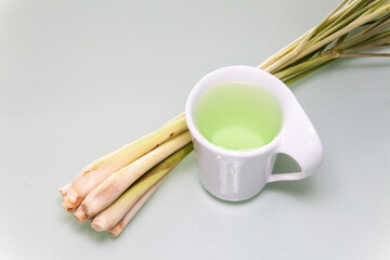 Lemon grass drink with a white cup view in close up with blur isolated background