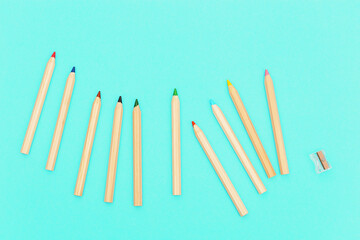 Wooden colored pencils. Social media and creativity background with copy space. Minimal style photography.