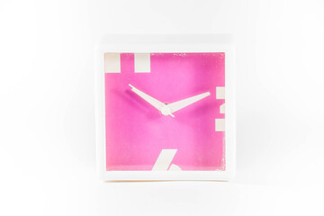 Pink rectangle clock in a white isolated background