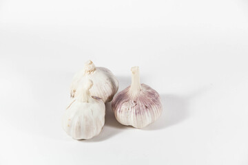 Raw fresh garlic in a white isolated background