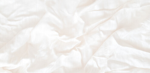 The white patterned fabric wrinkles using soft focus.