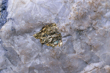 Molybdenite ore interspersed in marble. Minerals - molybdenite, pyrite, chalcopyrite, white quartz....
