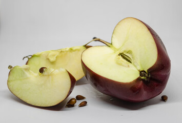 half of red apple on a white background