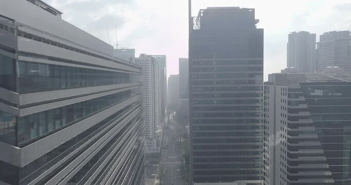 Ungraded, Straight aerial flight between skyscrapers in business district. Urban view. Drone, 4K. 