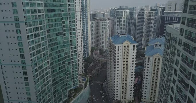 Ungraded, Aerial flight through high rise buildings. Development area. Urban city view. Drone, 4K. 
