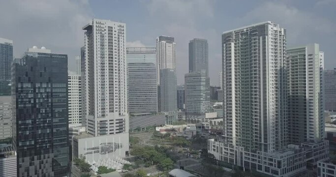 Ungraded, Zoom out aerial flight of business district to reveal urban panoramic view. Drone, 4K.