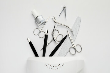 Supplies for manicure on white background - obrazy, fototapety, plakaty