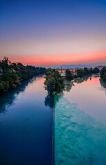Collision of two rivers. Arvre and Rhone rivers in Geneva.