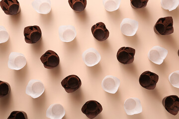 Muffin baking cups on color background