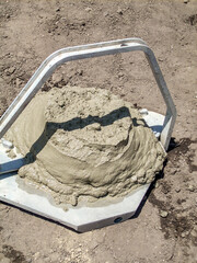 Concrete slump test  from cone to determine workability