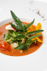 Healthy organic tomato soup. Modern creative restaurant meal. Exquisite dish, haute couture food.