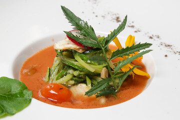 Healthy organic tomato soup. Modern creative restaurant meal. Exquisite dish, haute couture food.