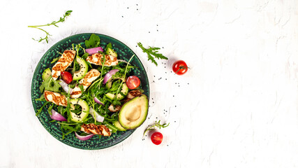 The concept of oriental cuisine. National Cyprus Salad with grilled Halloumi cheese, tomatoes, avocado, arugula. banner menu recipe place for text. Flat lay