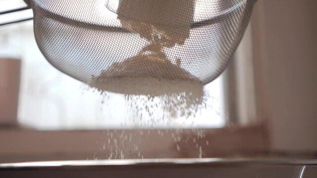 Sift flour through a sieve from a low angle