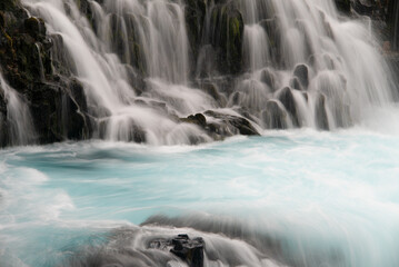Fototapeta na wymiar Bruarfoss waterfall Iceland blue glacial river long exposure
