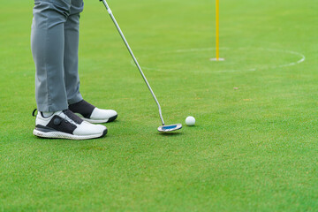 Fototapeta na wymiar Golfer preparing for a putt Golf ball on the green during golfcourse.