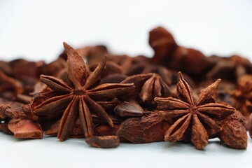 Star anise spice fruits and seeds isolated on white background closeup


