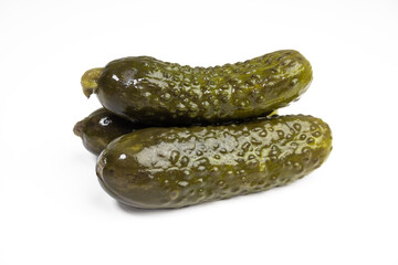 Three pickled gherkins isolated on white background.