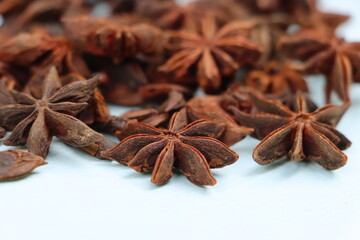 Star anise spice fruits and seeds isolated on white background closeup

