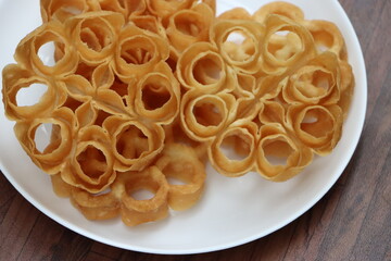 Rose Cookies or Achu Murruku, achapum, puvvulu, typical Anglo Indian cookie and the favorite among Indian Christians during christmas, made with flour, sugar, milk, popular in South India