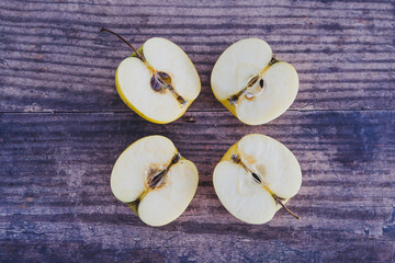 plant-based food, apple halves on wooden table