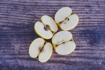 plant-based food, apple halves on wooden table