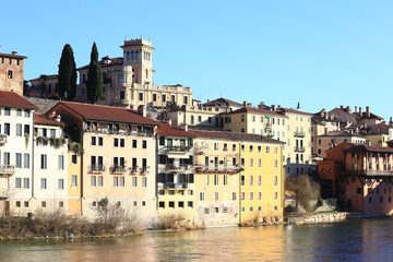 Fototapeta na wymiar bassano del grappa, Italy, 02/06/2020 , View of the city from the river at sunset.