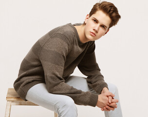 Attractive teenage boy posing in studio