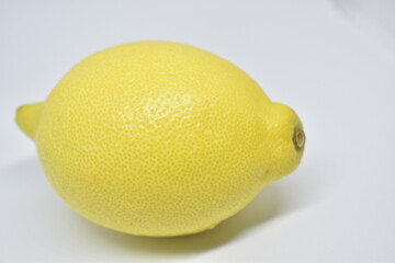 Lemon. One whole lemon isolated on white background