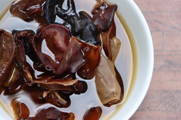 Rehydrated wood ear mushroom or black jew mushroom in white bowl, delicacy of Sikkim