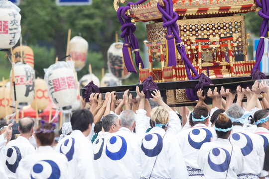 Chiba, Japan, 08/22/2019 , participants of the 893rd Myoken Big Festival transporting the Mikoshi, a sacred religious palanquin (portable shinto Shrine) held in Chiba, Japan.