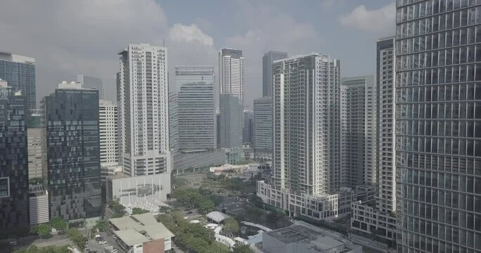 Ungraded, Straight aerial flight through high rise buildings in business district area. Drone, 4K. 