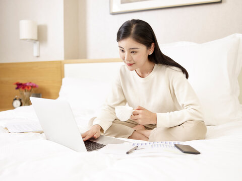 young asian businesswoman working from home