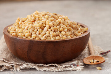 Wooden bowl with cereal from wheat grains.Healthy eating. Food trend.