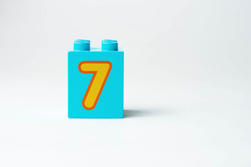 the number seven written on the block from the children's constructor