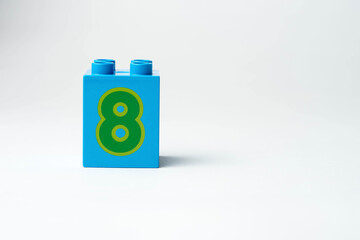 the number eight written on the block from the children's constructor