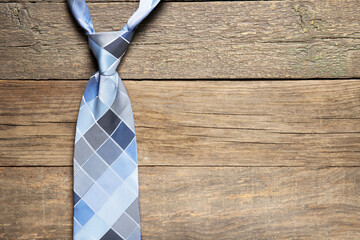 Tie on a wooden background. Place for text. Holiday daddy's day