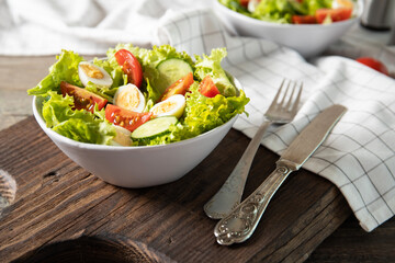 Tasty salad of fresh vegetables with quail eggs. Diet concept