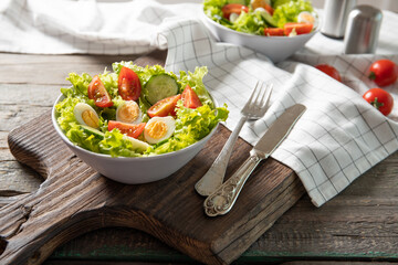 Tasty salad of fresh vegetables with quail eggs. Diet concept