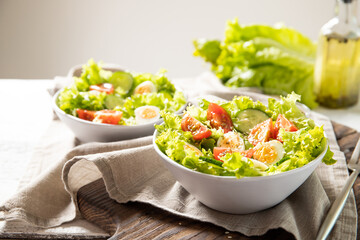 Tasty salad of fresh vegetables with quail eggs. Diet concept