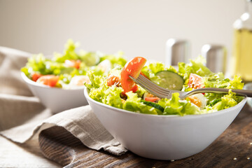 Tasty salad of fresh vegetables with quail eggs. Diet concept