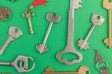 Background made from different metal keys on the green base