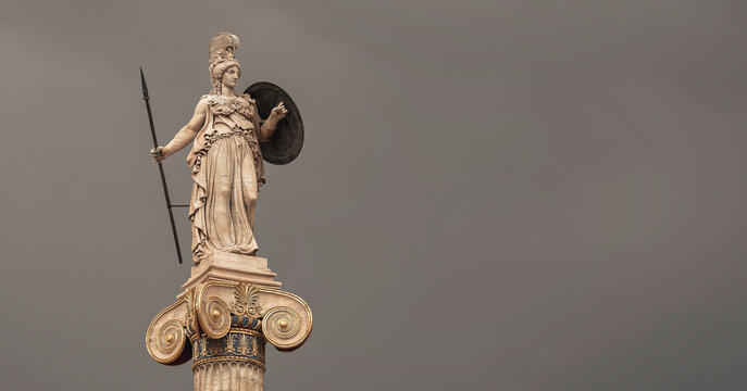 Athena goddess marble statue with spear and shield isolated on dark grey sky background, lots of space for text