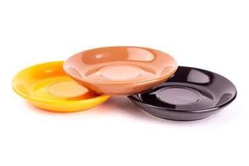 Brown, orange and black plates on white background. Different small plate isolate