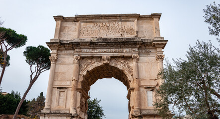 Fototapeta na wymiar Rome Italy. Eternal city famous in the world. The historic center is on the UNESCO World Heritage List with many points of archaeological interest. View of the Arch of Titus in the Roman Forum.