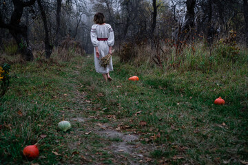 Woman walking barefoot in autumn foggy forest