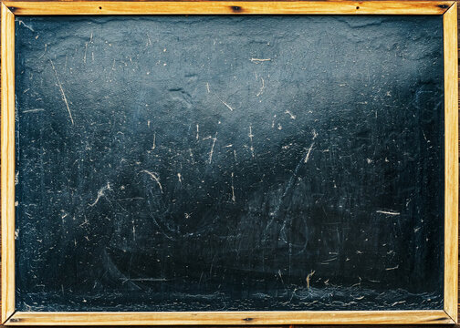 Background of an old blackboard for chalk with a wooden frame, free space as a substrate and background.