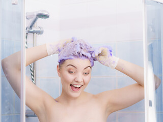 Woman applying toner shampoo on her hair