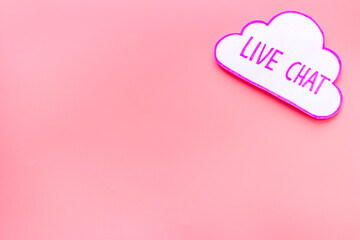 Live chat communication concept - words on pink background top view